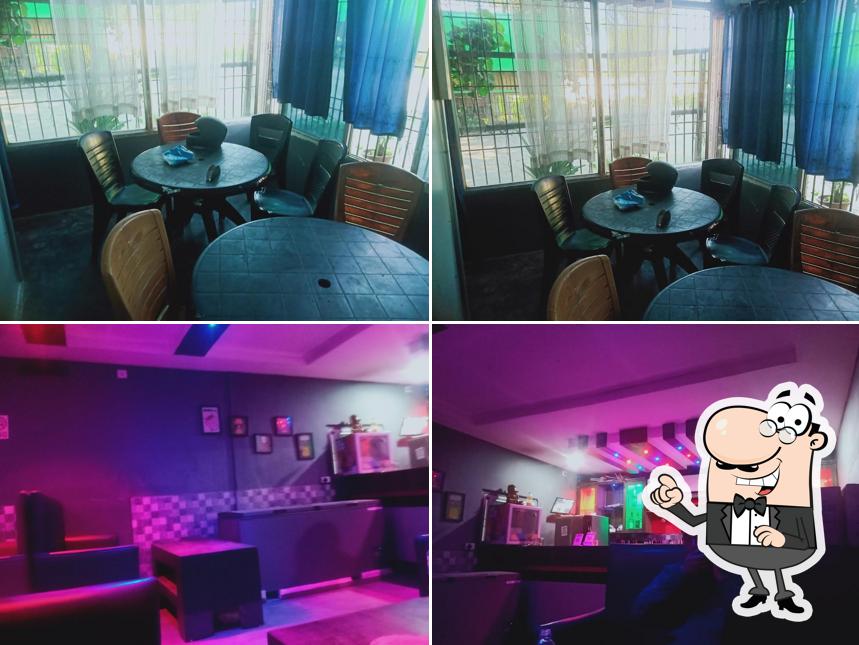 Take a seat at one of the tables at Kuwali Bar & Restaurant