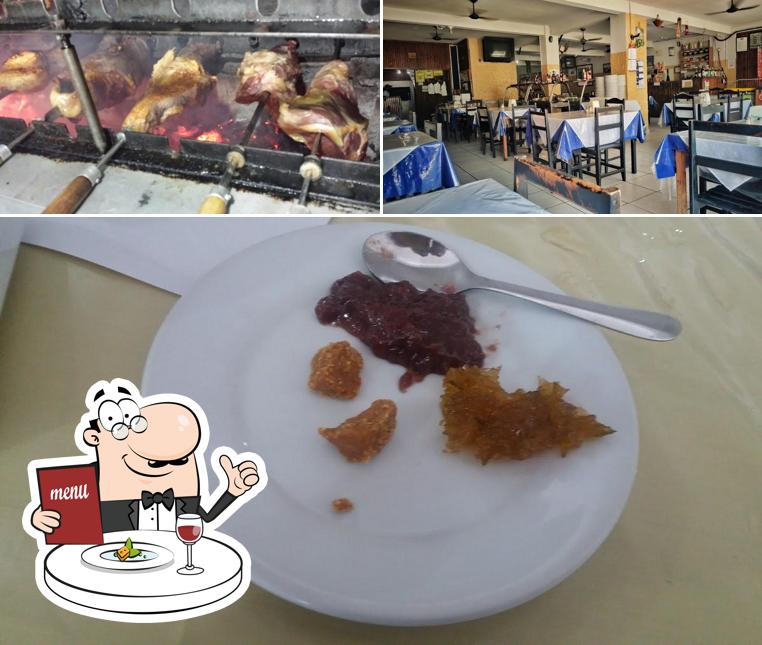 Esta é a imagem apresentando comida e interior a Churrascaria Ipiranga