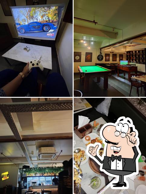 Take a seat at one of the tables at The Beer Cafe, Guwahati