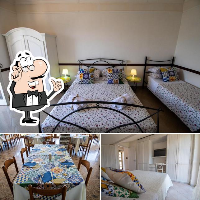 Siediti a un tavolo di Hotel Restaurant Madonna della Scala