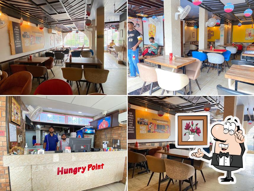 Take a seat at one of the tables at Hungry Point