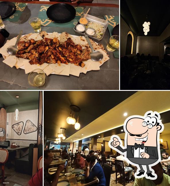 Take a seat at one of the tables at Ramees Restaurant