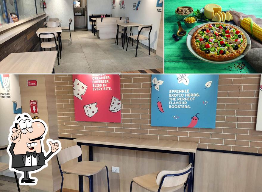 This is the picture showing interior and food at Domino's Pizza Poker arcade, Nashik