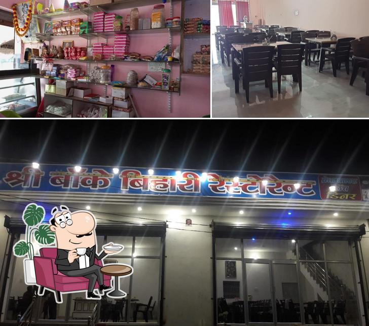 Take a seat at one of the tables at PreetiBhoj Restaurant & Guest House