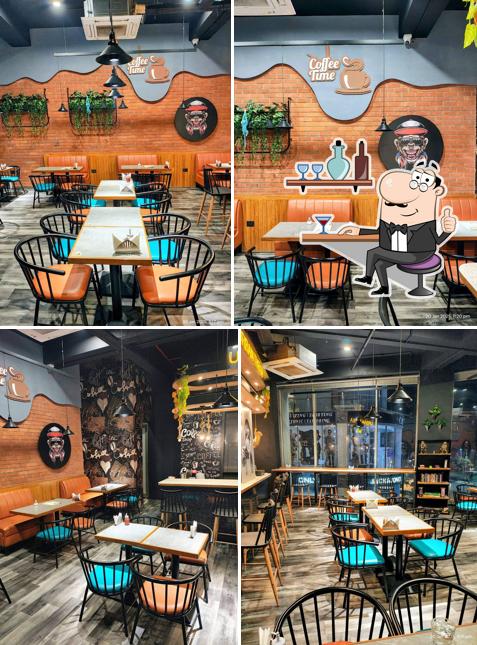 Take a seat at one of the tables at Urban Theka Cafe