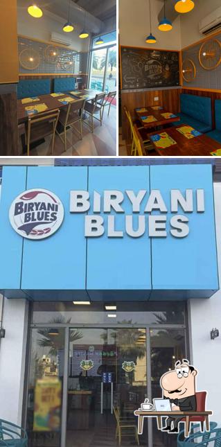 Take a seat at one of the tables at Biryani Blues