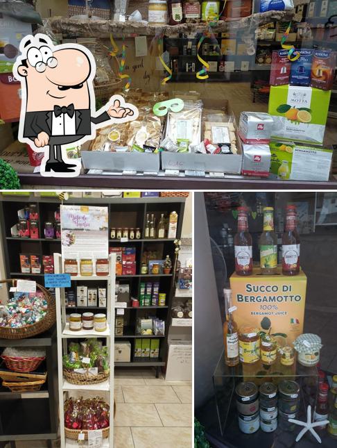Guarda la foto che mostra la interni e birra di Capsule caffe' Carignano Aromissima