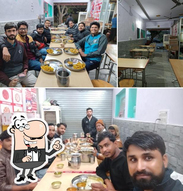 Take a seat at one of the tables at Maa bhawani daal bati and special choorma and restaurant