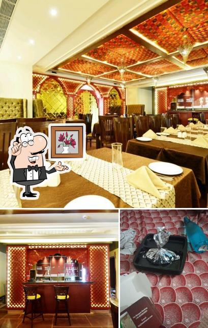 Take a seat at one of the tables at Hotel Riyasat