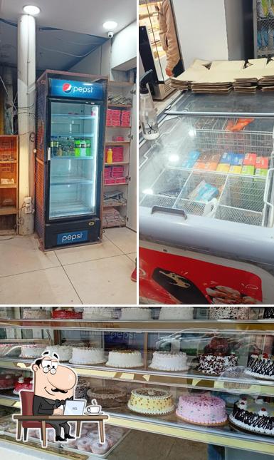 Take a seat at one of the tables at Shri Radhe Bakers Sweet Confectionery