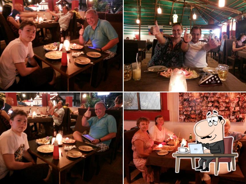 Take a seat at one of the tables at Caravelha