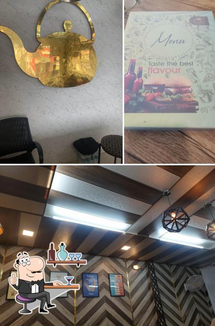 Check out the image showing interior and burger at The Golden Kettle