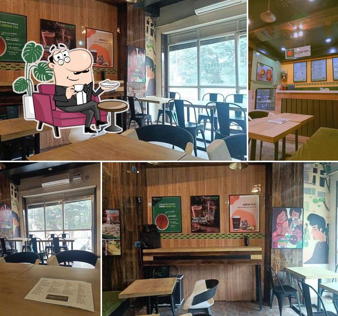 Take a seat at one of the tables at Chai Garam Pocket Cafe