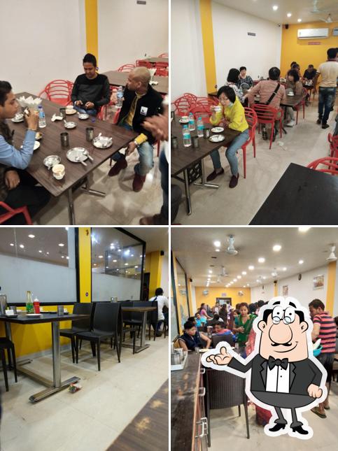 Take a seat at one of the tables at Upasana Food Emporium
