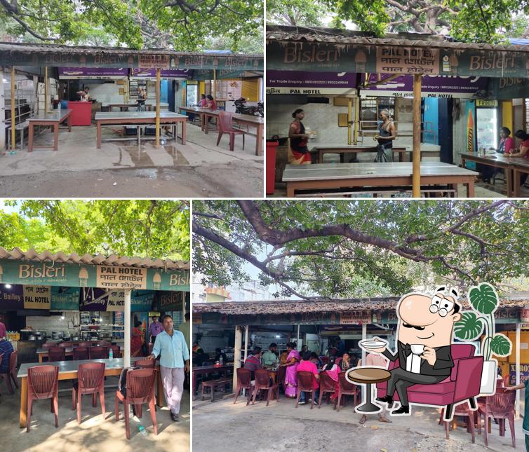 Take a seat at one of the tables at Pal Hotel