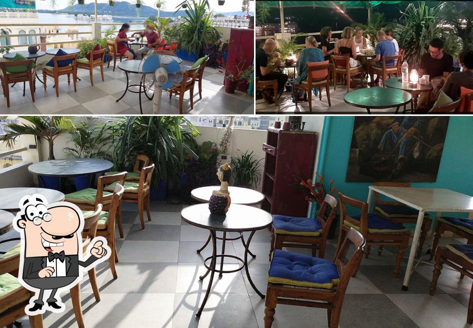 Take a seat at one of the tables at Savage Garden Restaurant