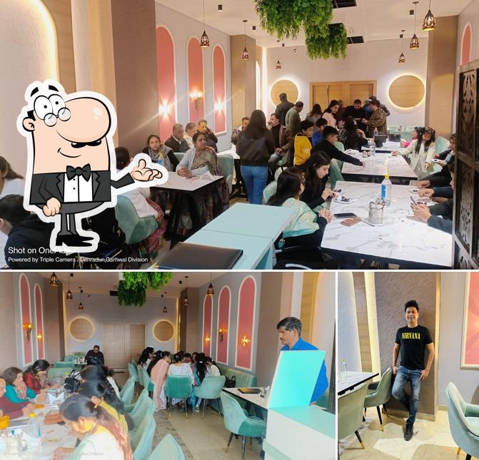 Take a seat at one of the tables at Devrana Express Multi cuisine restaurant