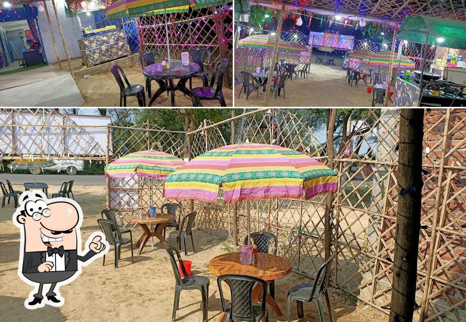Take a seat at one of the tables at Pankaj Restaurant