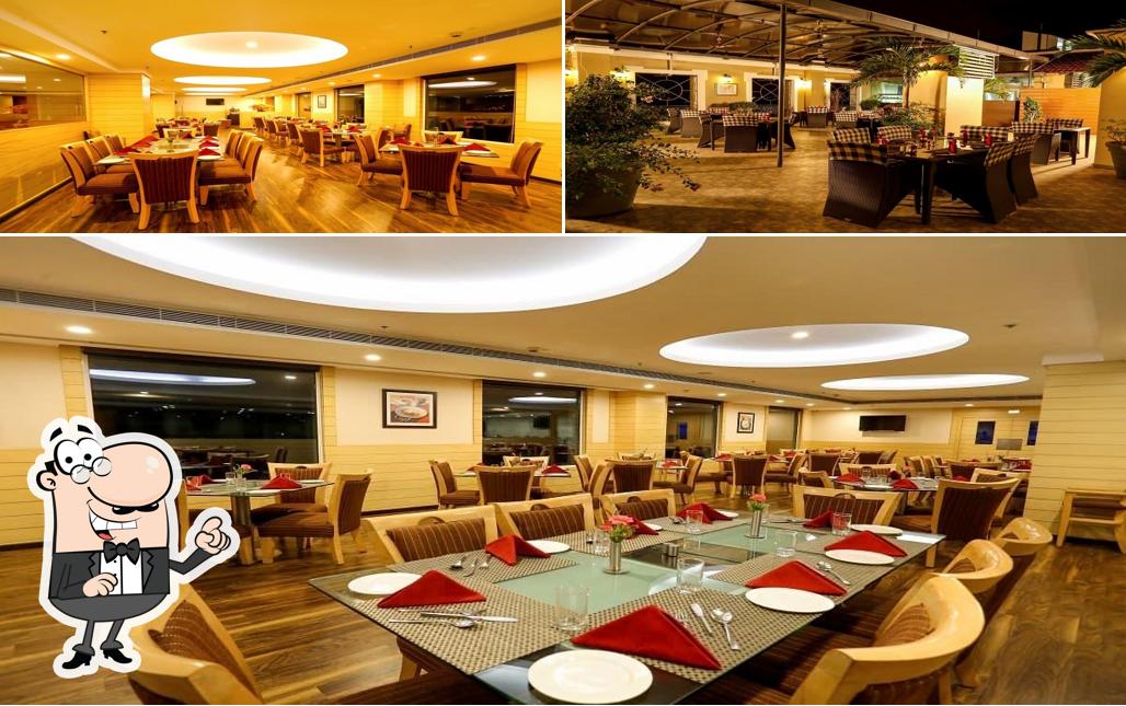 Take a seat at one of the tables at Sivaraj Inn