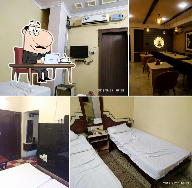 Take a seat at one of the tables at HOTEL NATRAJ MINI - Hotel, Bar & Restaurants