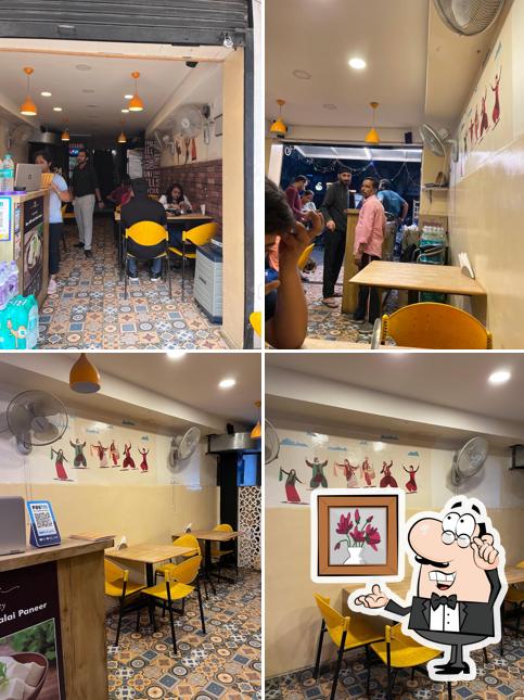 Take a seat at one of the tables at Sardarji Da Dhaba