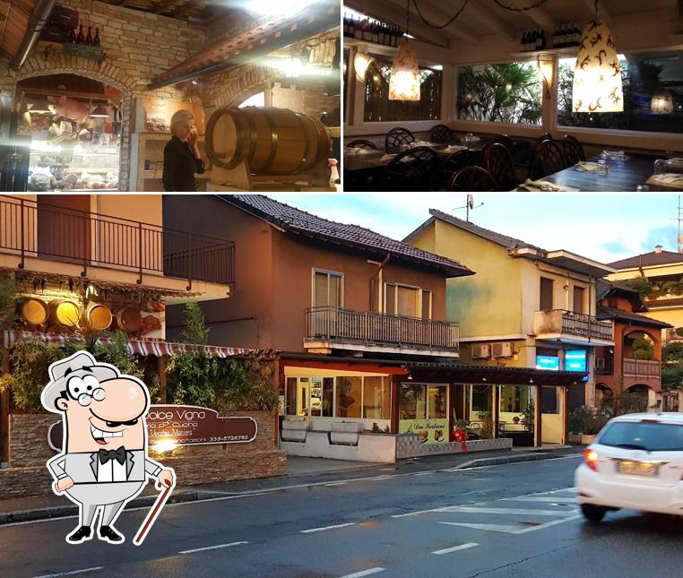 La immagine di esterno e tavolo da pranzo da La Dolce Vigna