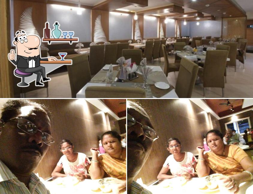 Take a seat at one of the tables at Dakshin Restaurant