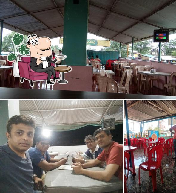 Take a seat at one of the tables at Hardik Chinese & Punjabi Restaurant