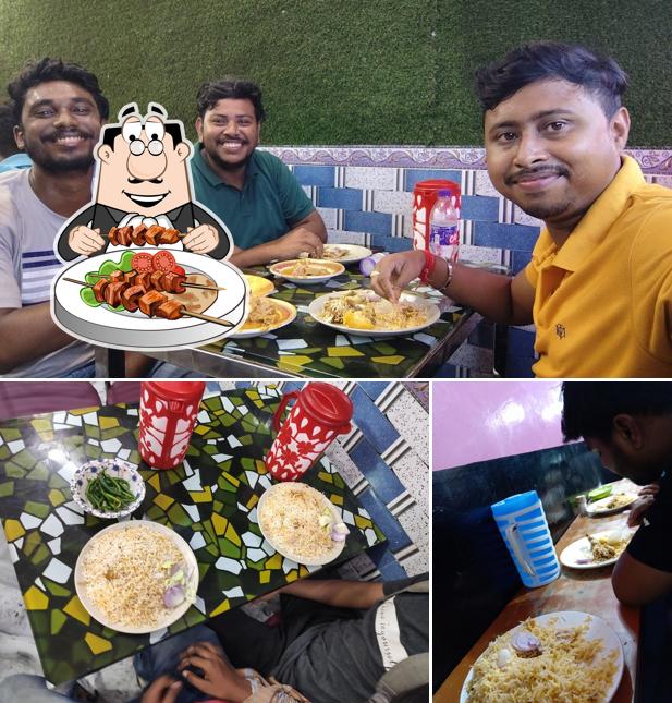 Take a look at the photo showing food and dining table at Kashmir Biriyani
