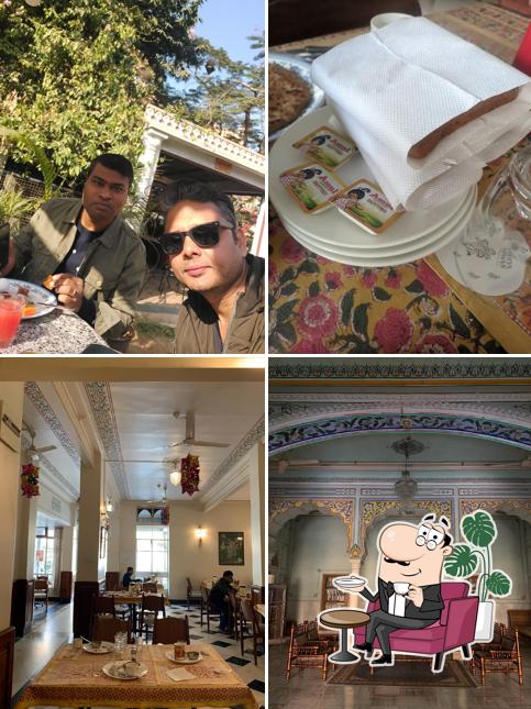 Take a seat at one of the tables at Chitra Cafe