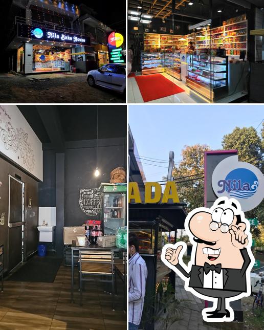 Take a seat at one of the tables at NILA BAKES & CAFE AKAMALA