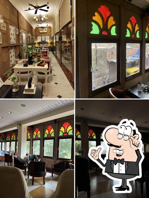 Take a seat at one of the tables at Café Sheesh Mahal