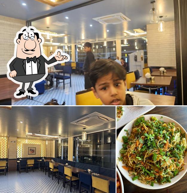 Take a seat at one of the tables at Sankalp Multicuisine Restaurant