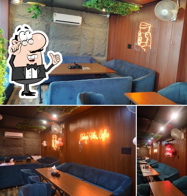 Take a seat at one of the tables at The Hanging Park Cafe and Restaurant