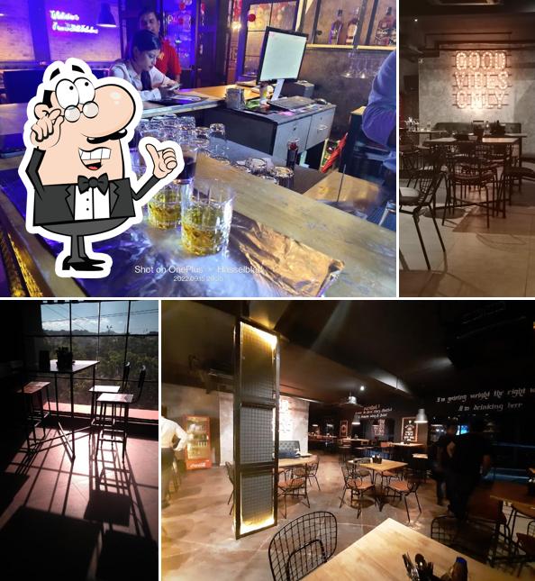 Take a seat at one of the tables at Bottle - Bar & Restaurant
