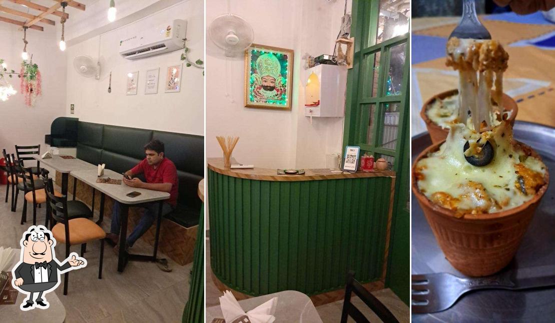 Take a seat at one of the tables at Italian Chaskaa Cafe & Resto