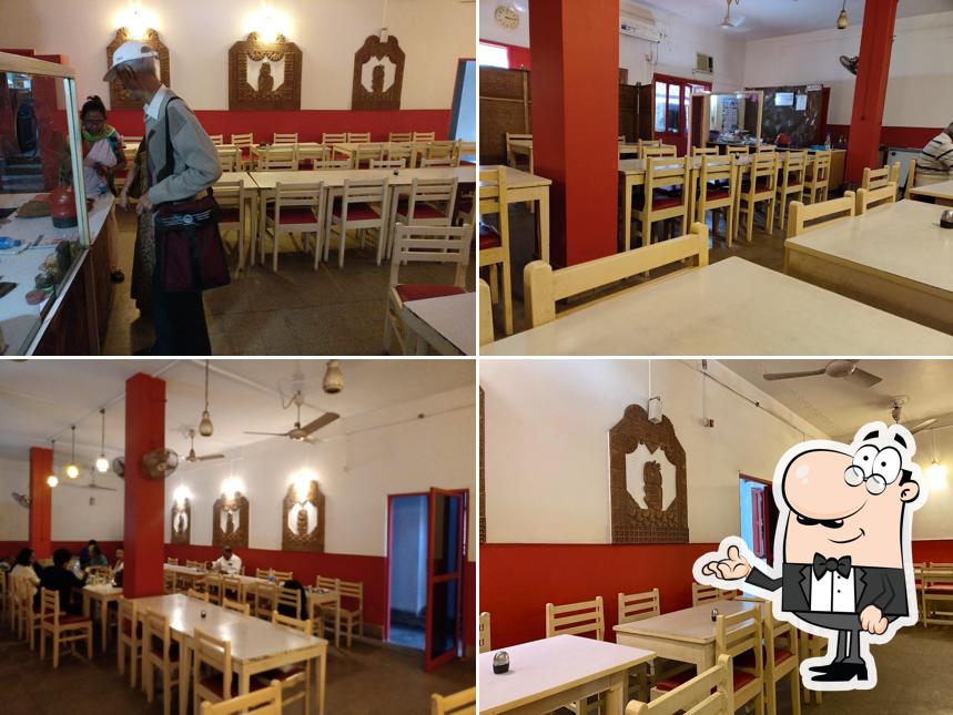 Take a seat at one of the tables at ELLIOT ROAD SURUCHI SELF HELP GROUP