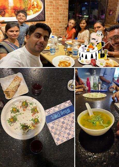 Check out the photo showing food and interior at Blue Dot Restaurant