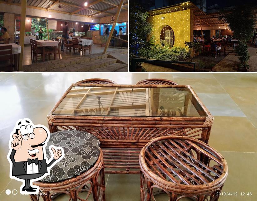 Take a seat at one of the tables at Kamla