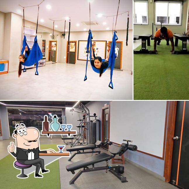 Take a seat at one of the tables at Absolute GYM - Yoga & Zumba Steam & Massage Best Gym in Jamshedpur Unisex Gym in Jamshedpur