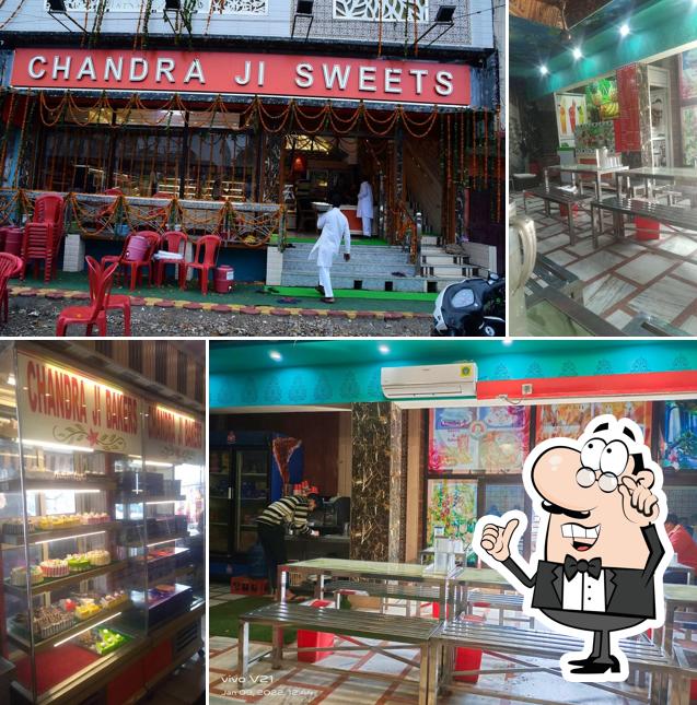 Take a seat at one of the tables at Chandra Ji Sweets