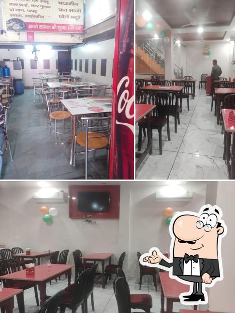 Take a seat at one of the tables at M.N Punjabi Dhaba