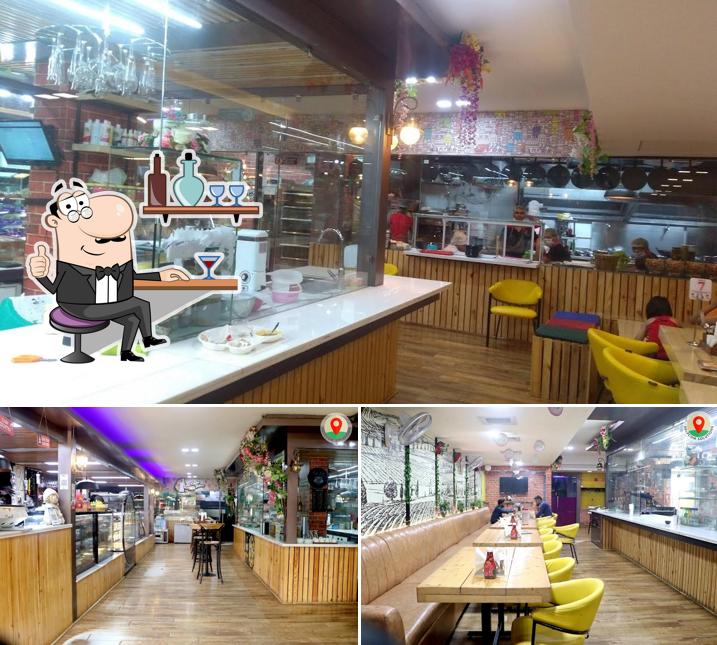 Take a seat at one of the tables at ROYAL LIVE BAKERY & RESTAURANT - BAKERY IN HISAR