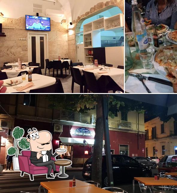 La interni e tavolo da pranzo del ristorante