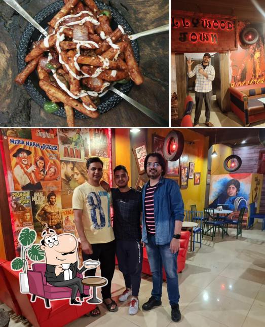 This is the image displaying interior and food at Bollywood Town