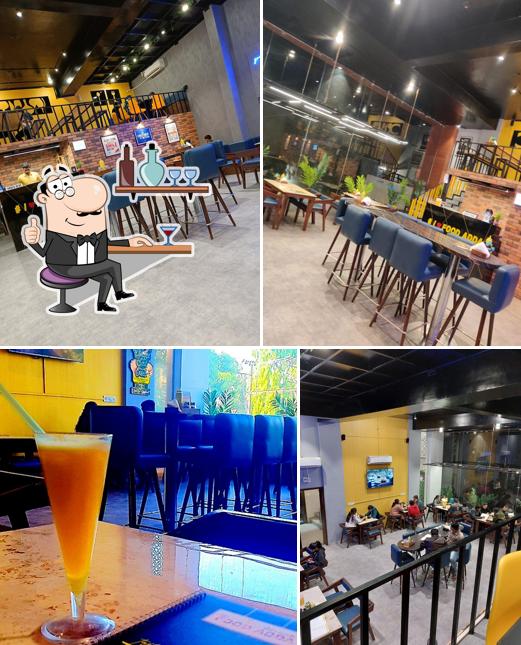 Take a seat at one of the tables at FOOD ADDA (Amin Marg)