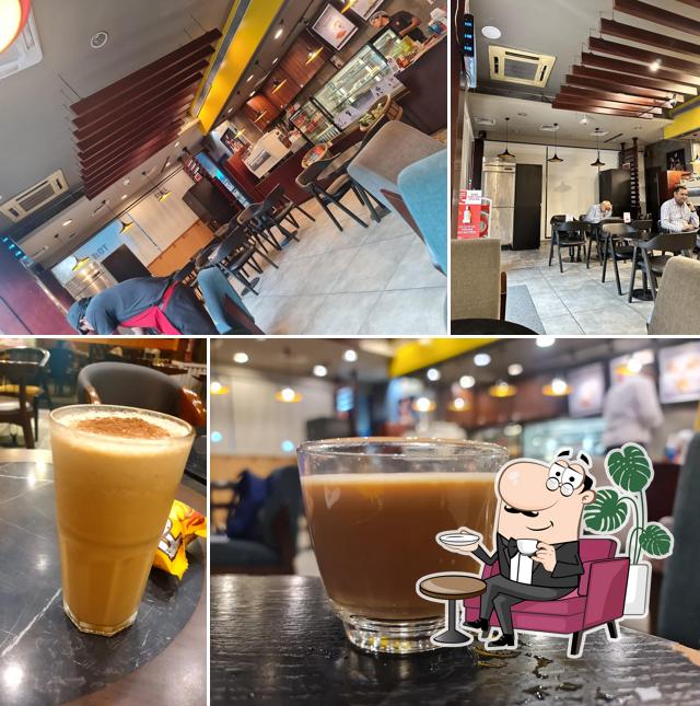 Take a seat at one of the tables at Café Coffee Day