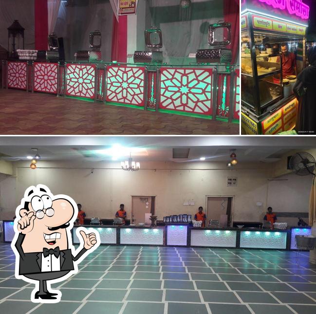 Take a seat at one of the tables at Mahalaxmi Chat Centre & Catring