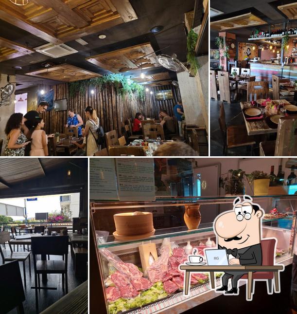 Dai un'occhiata agli interni di Sneezy pub&grill