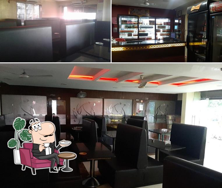 Among different things one can find interior and bar counter at Mid City Bar & Multi Cuisine Restaurant